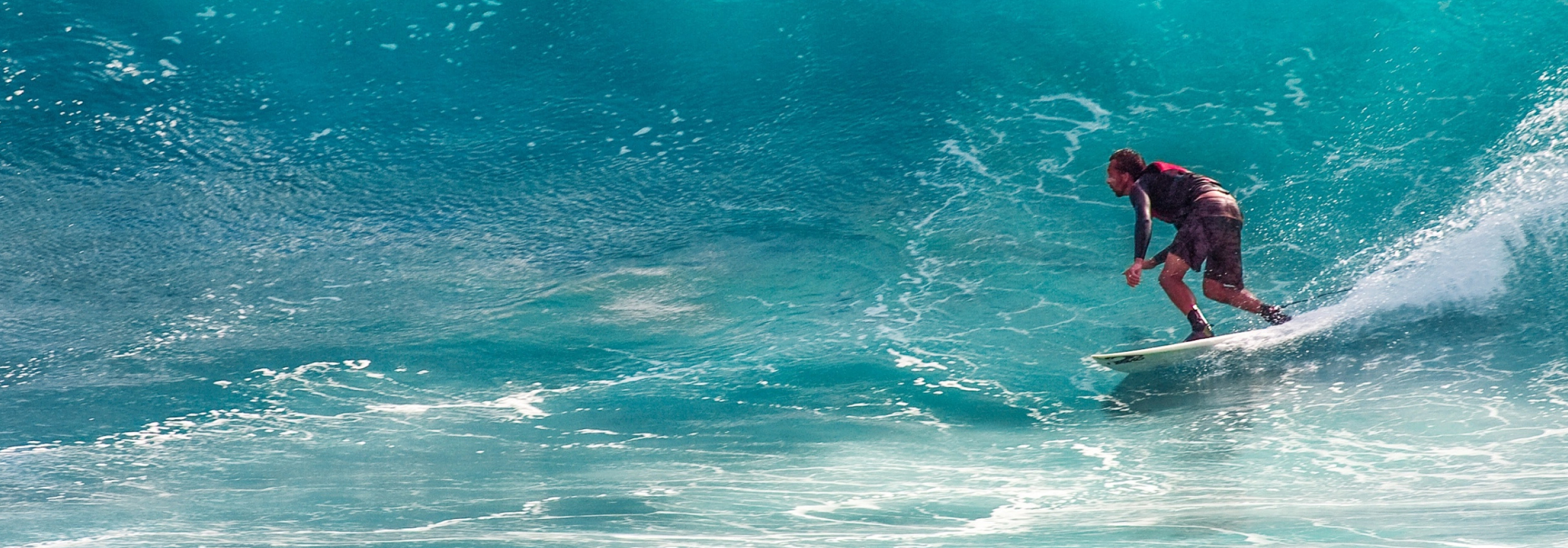 surfer beating the waves